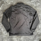 Stone Island black overshirt with logo badge and nylon metal material.