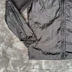 Stone Island black overshirt with logo badge and nylon metal material.