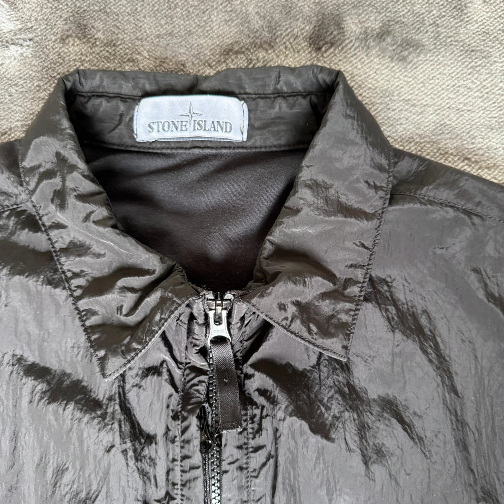 Stone Island black overshirt with logo badge and nylon metal material.
