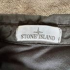 Stone Island black overshirt with logo badge and nylon metal material.