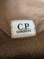 C.P. Company khaki goggle hoodie with side zip and logo detail.