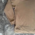C.P. Company khaki goggle hoodie with side zip and logo detail.