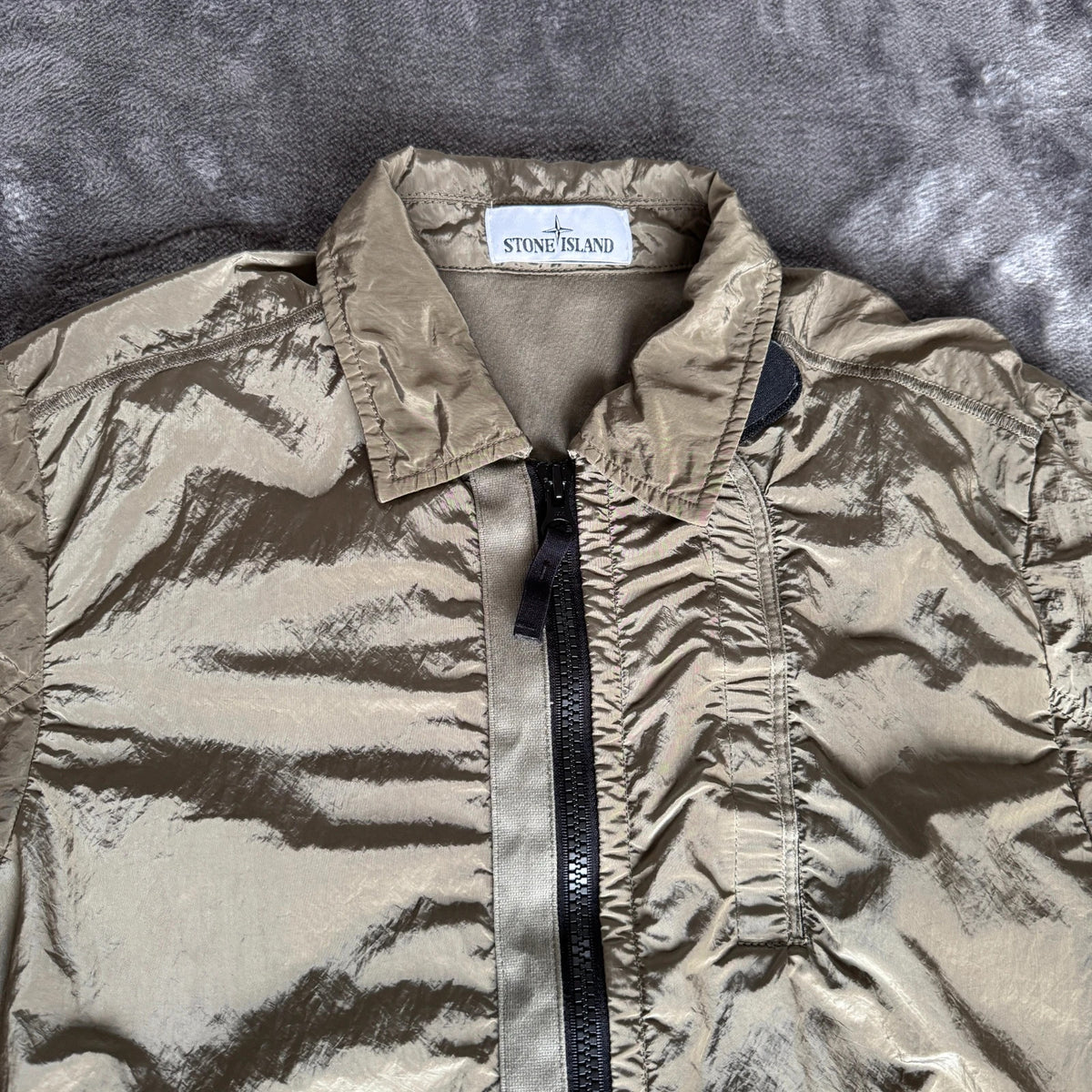 Stone Island khaki overshirt with logo patch and nylon metal cotton blend material.