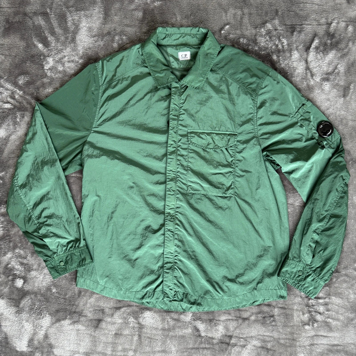 C.P. Company green overshirt with Chrome-R pocket and lens detail, brand new condition.