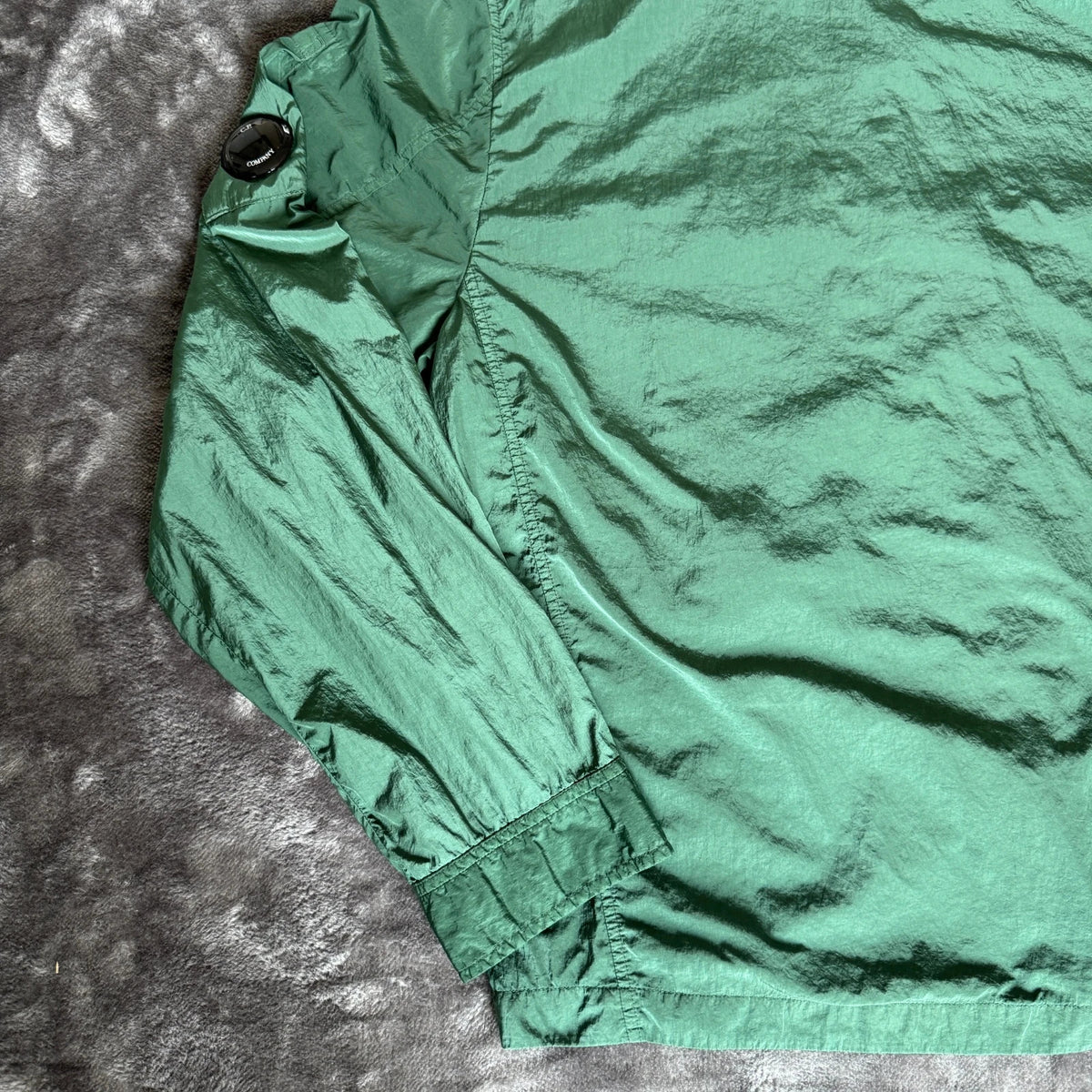 C.P. Company green overshirt with Chrome-R pocket and lens detail, brand new condition.