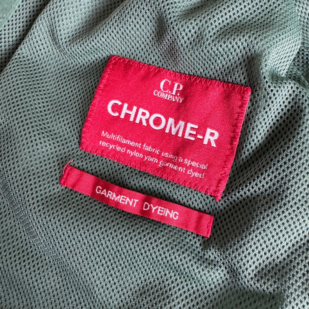 C.P. Company green overshirt with Chrome-R pocket and lens detail, brand new condition.