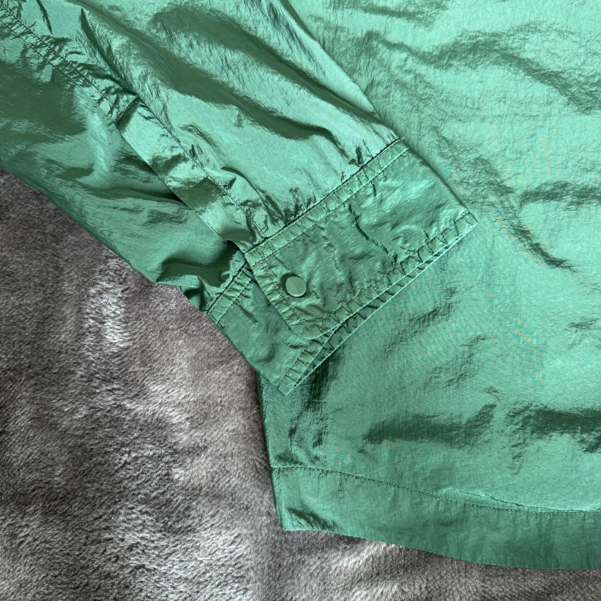 C.P. Company green overshirt with Chrome-R pocket and lens detail, brand new condition.