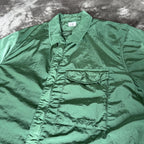 C.P. Company green overshirt with Chrome-R pocket and lens detail, brand new condition.