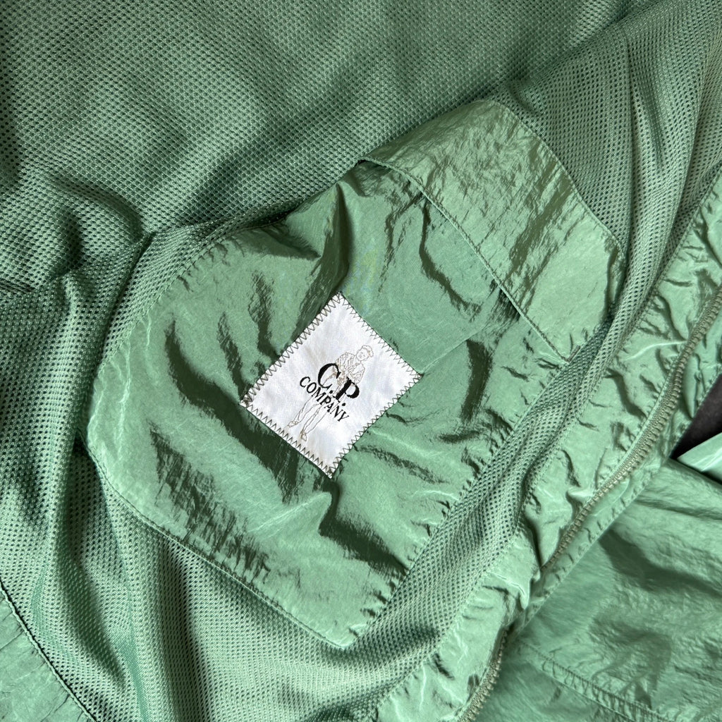C.P. Company green overshirt with Chrome-R pocket and lens detail, brand new condition.