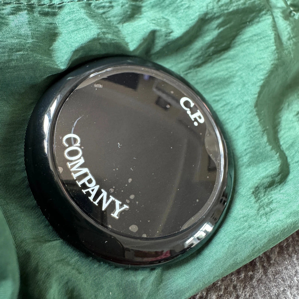C.P. Company green overshirt with Chrome-R pocket and lens detail, brand new condition.