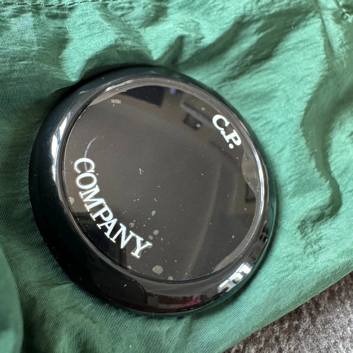 C.P. Company green overshirt with Chrome-R pocket and lens detail, brand new condition.