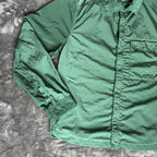C.P. Company green overshirt with Chrome-R pocket and lens detail, brand new condition.