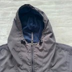 Napapijri grey pullover jacket with logo patch and ventilation zips, lightweight anorak design.