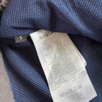 Napapijri grey pullover jacket with logo patch and ventilation zips, lightweight anorak design.
