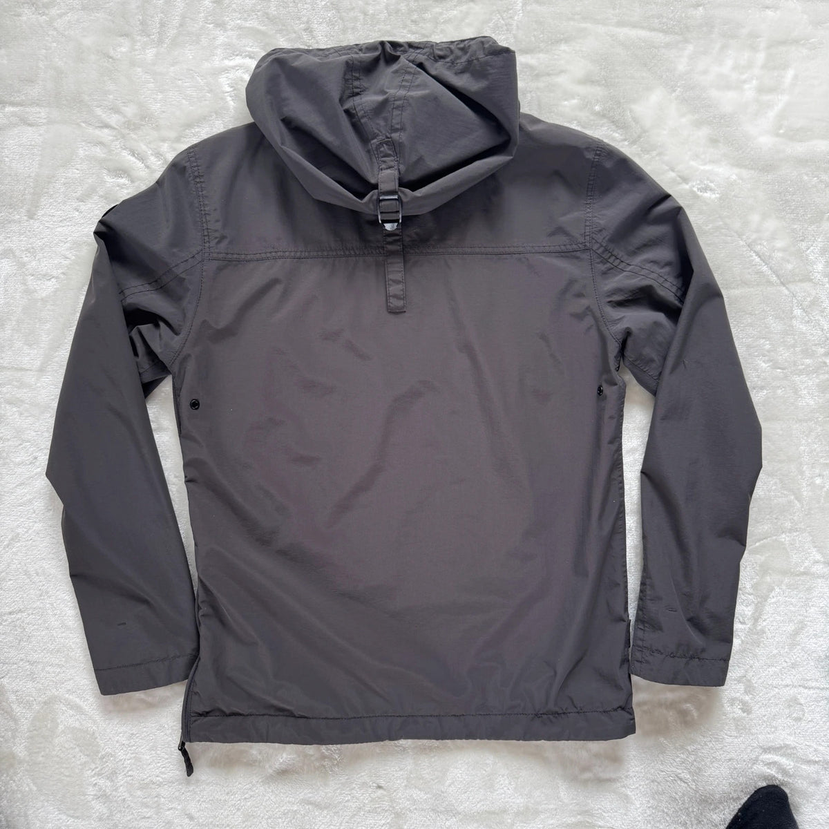 Napapijri grey pullover jacket with logo patch and ventilation zips, lightweight anorak design.