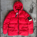 Stone Island red puffer jacket with compass patch, adjustable hood, and multiple pockets.