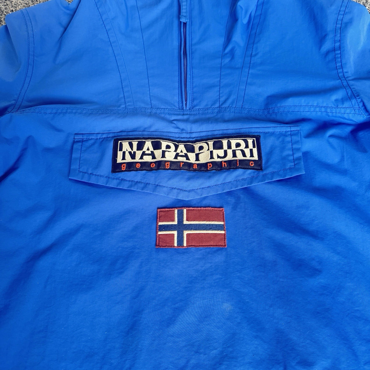 Napapijri blue anorak jacket with logo chest flap and quarter-zip front closure.