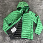 Stone Island green down jacket with logo patch and 0-cotton/R-nylon material.