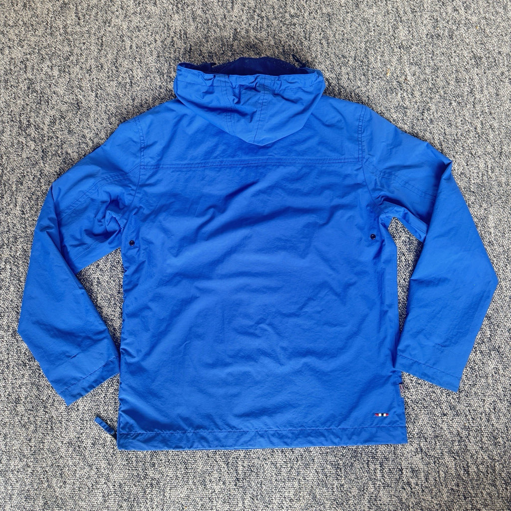 Napapijri blue anorak jacket with logo chest flap and quarter-zip front closure.