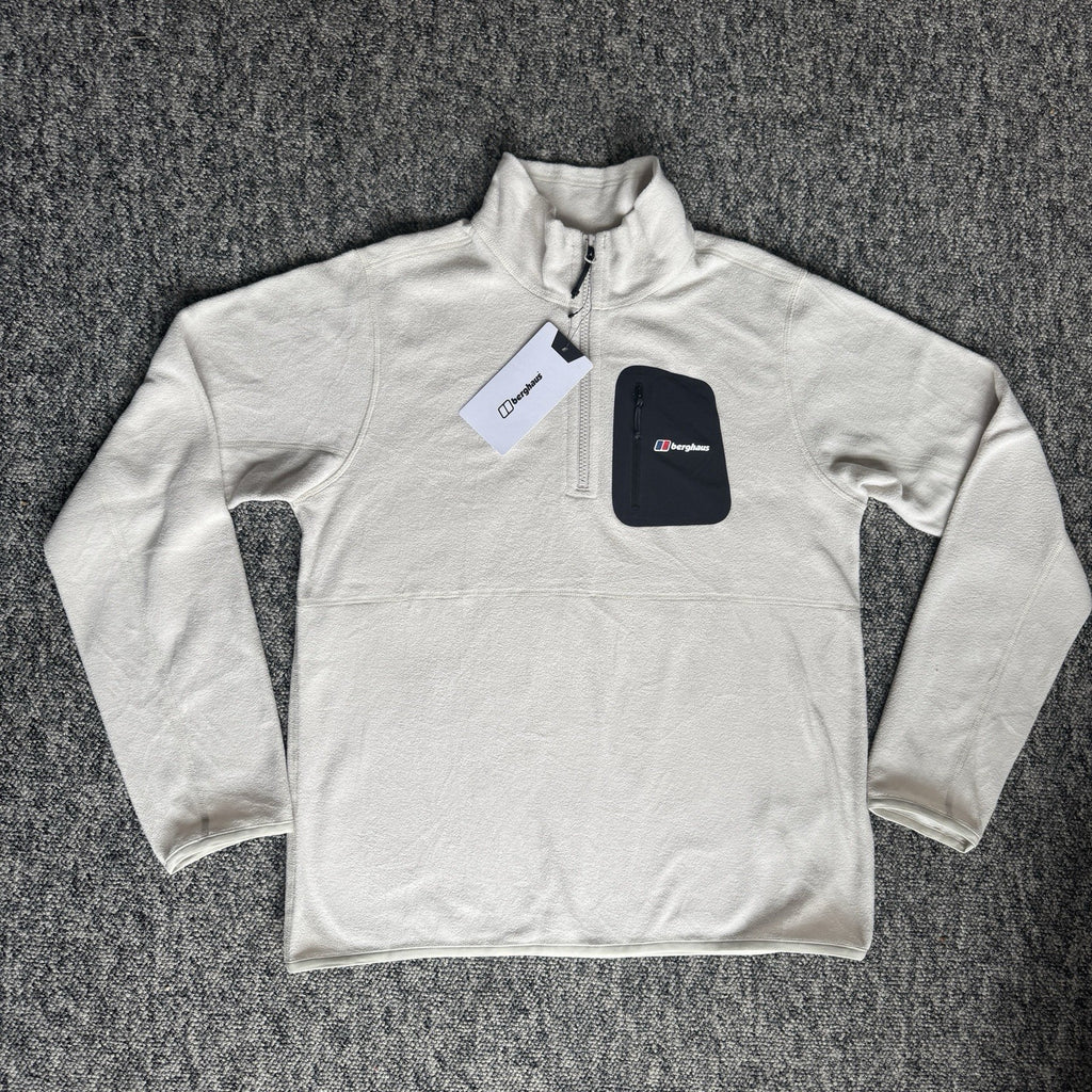 Berghaus off-white half-zip fleece with black logo pocket and stand-up collar.