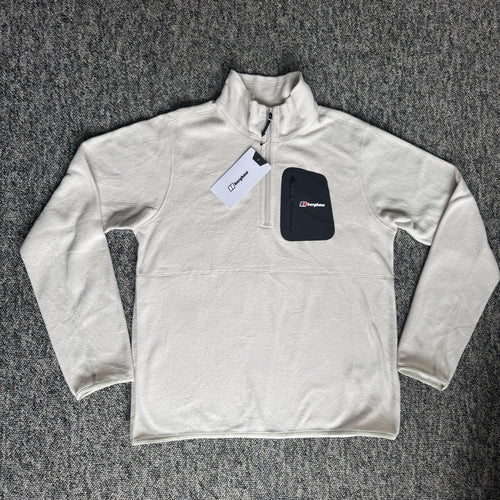 Berghaus off-white half-zip fleece with black logo pocket and stand-up collar.