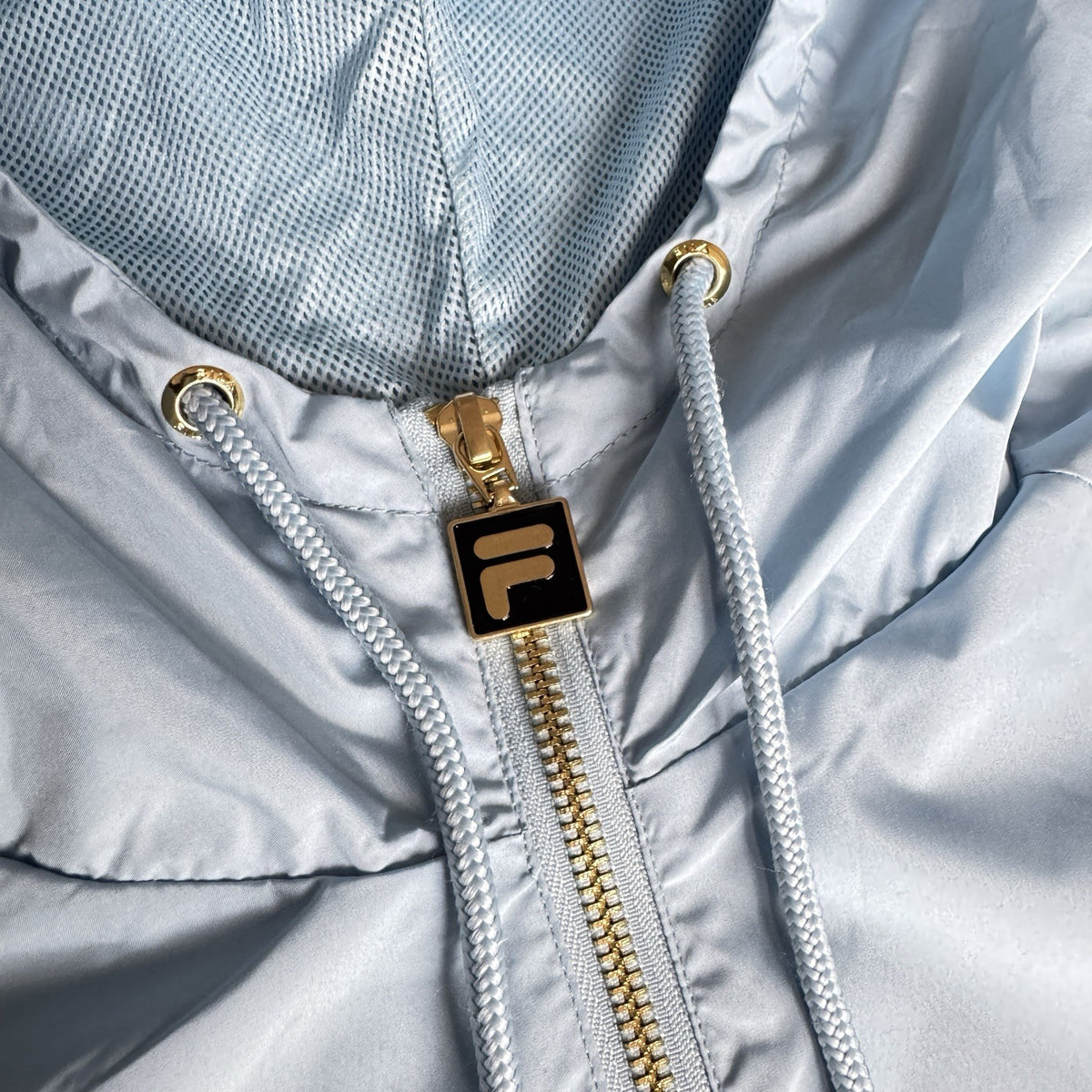 Fila lightweight hooded jacket light sky blue embroidered chest logo gold-tone zip hardware