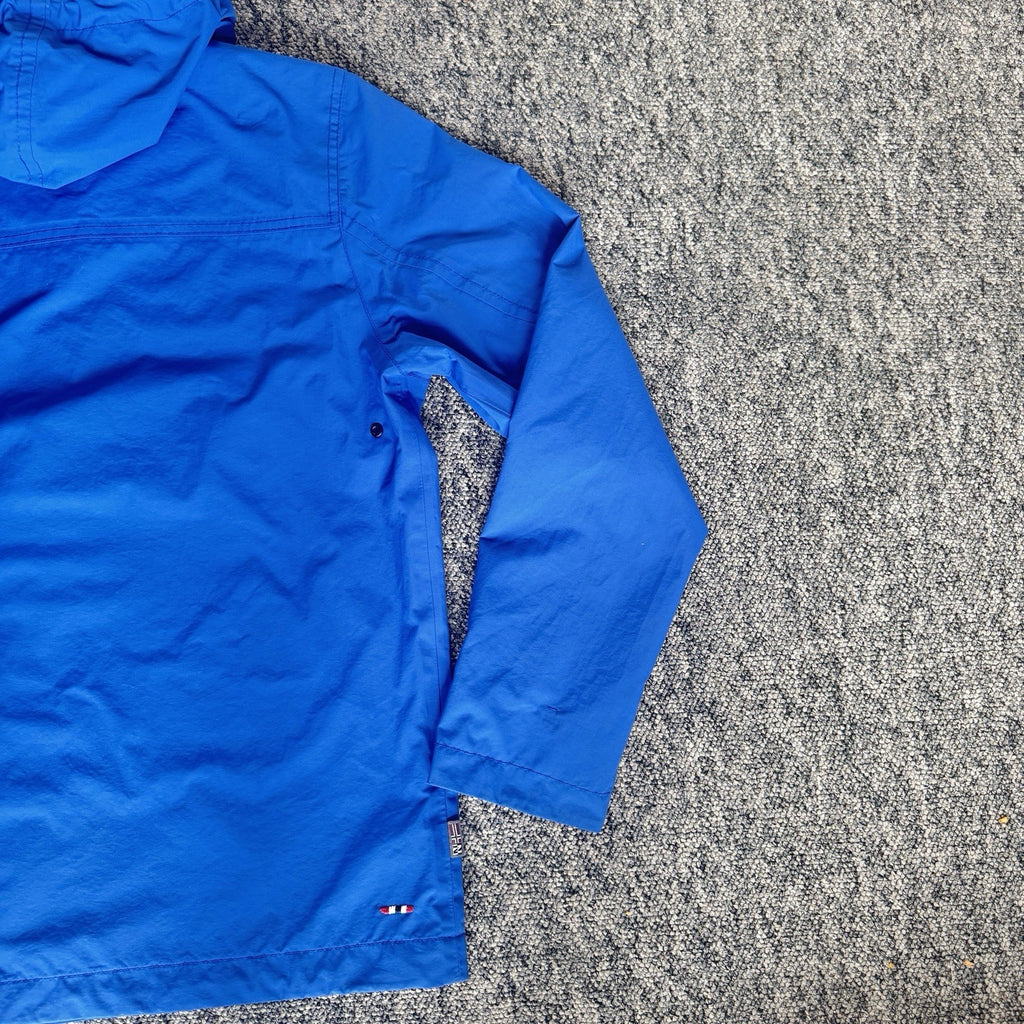 Napapijri blue anorak jacket with logo chest flap and quarter-zip front closure.
