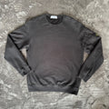 Stone Island black crewneck sweatshirt with zipped pocket and iconic compass logo.
