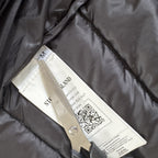 Stone Island green down jacket with logo patch and 0-cotton/R-nylon material.
