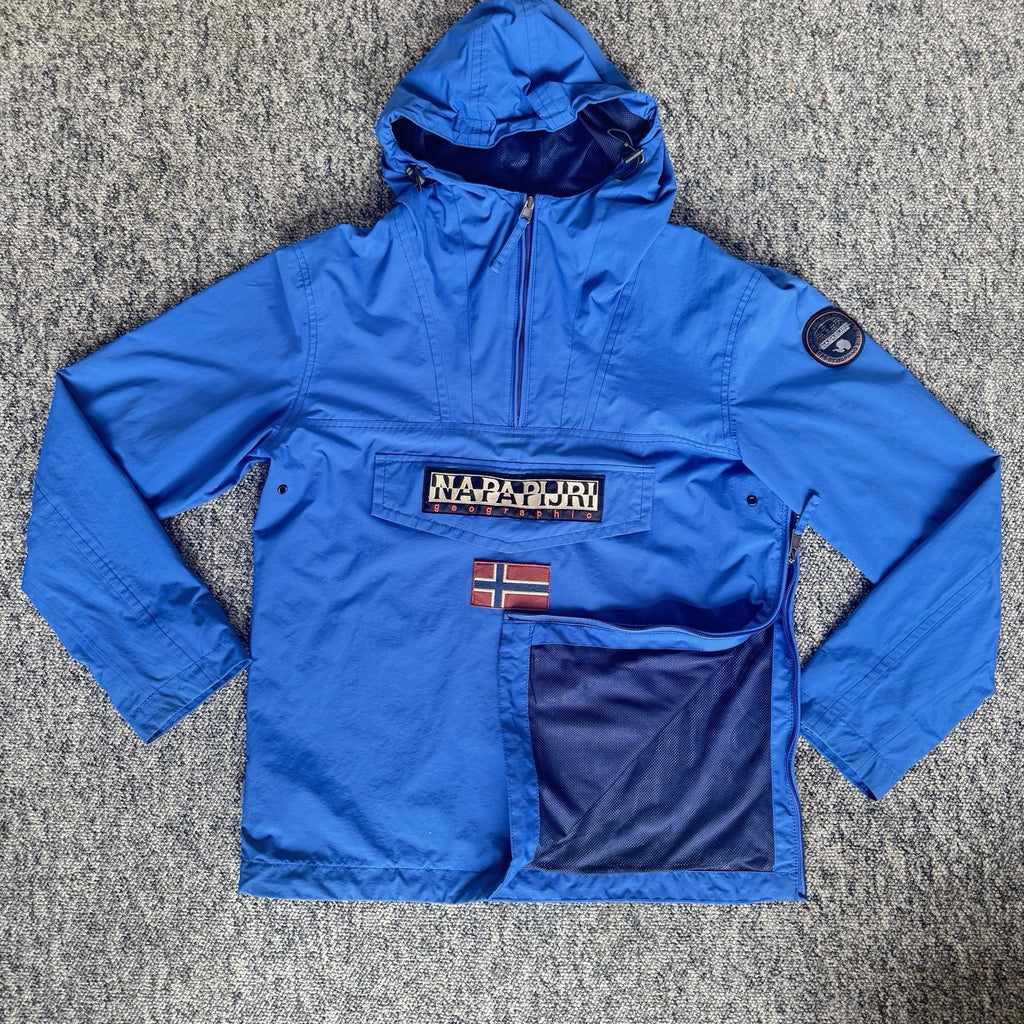 Napapijri blue anorak jacket with logo chest flap and quarter-zip front closure.