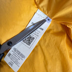 Stone Island yellow down jacket with crinkle reps texture and iconic compass logo.