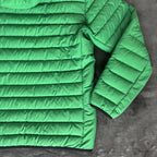Stone Island green down jacket with logo patch and 0-cotton/R-nylon material.