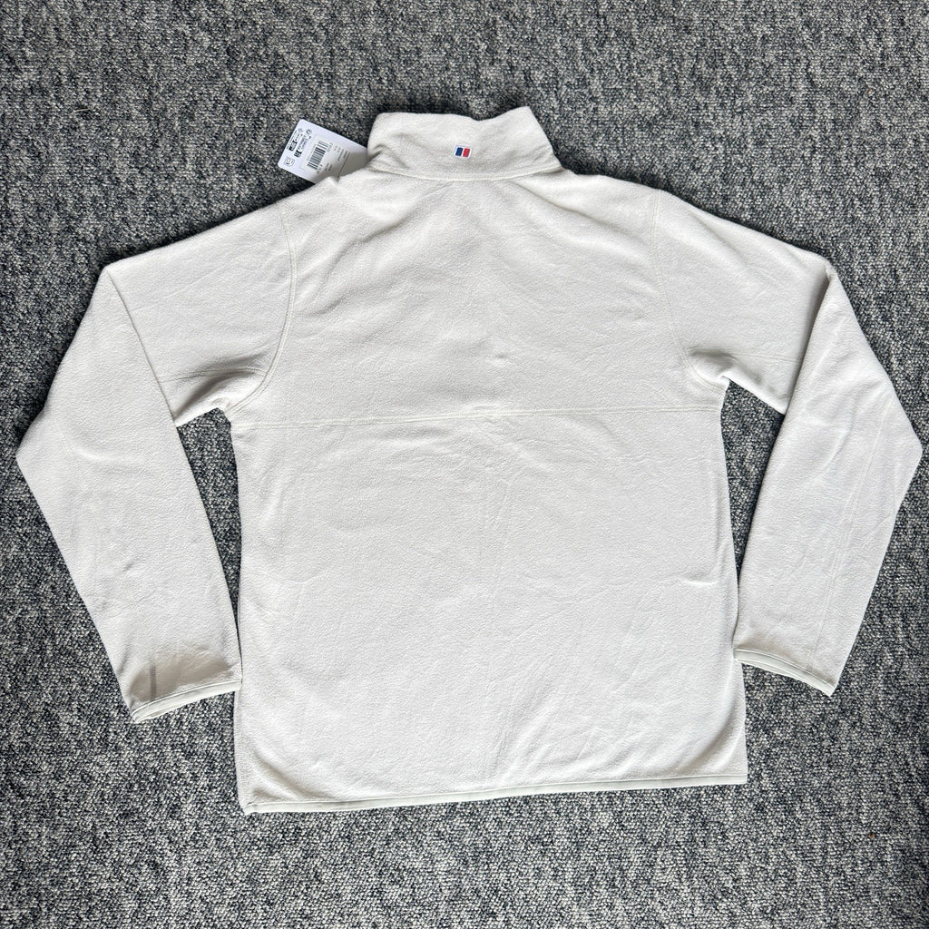 Berghaus off-white half-zip fleece with black logo pocket and stand-up collar.