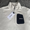 Berghaus off-white half-zip fleece with black logo pocket and stand-up collar.