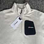 Berghaus off-white half-zip fleece with black logo pocket and stand-up collar.